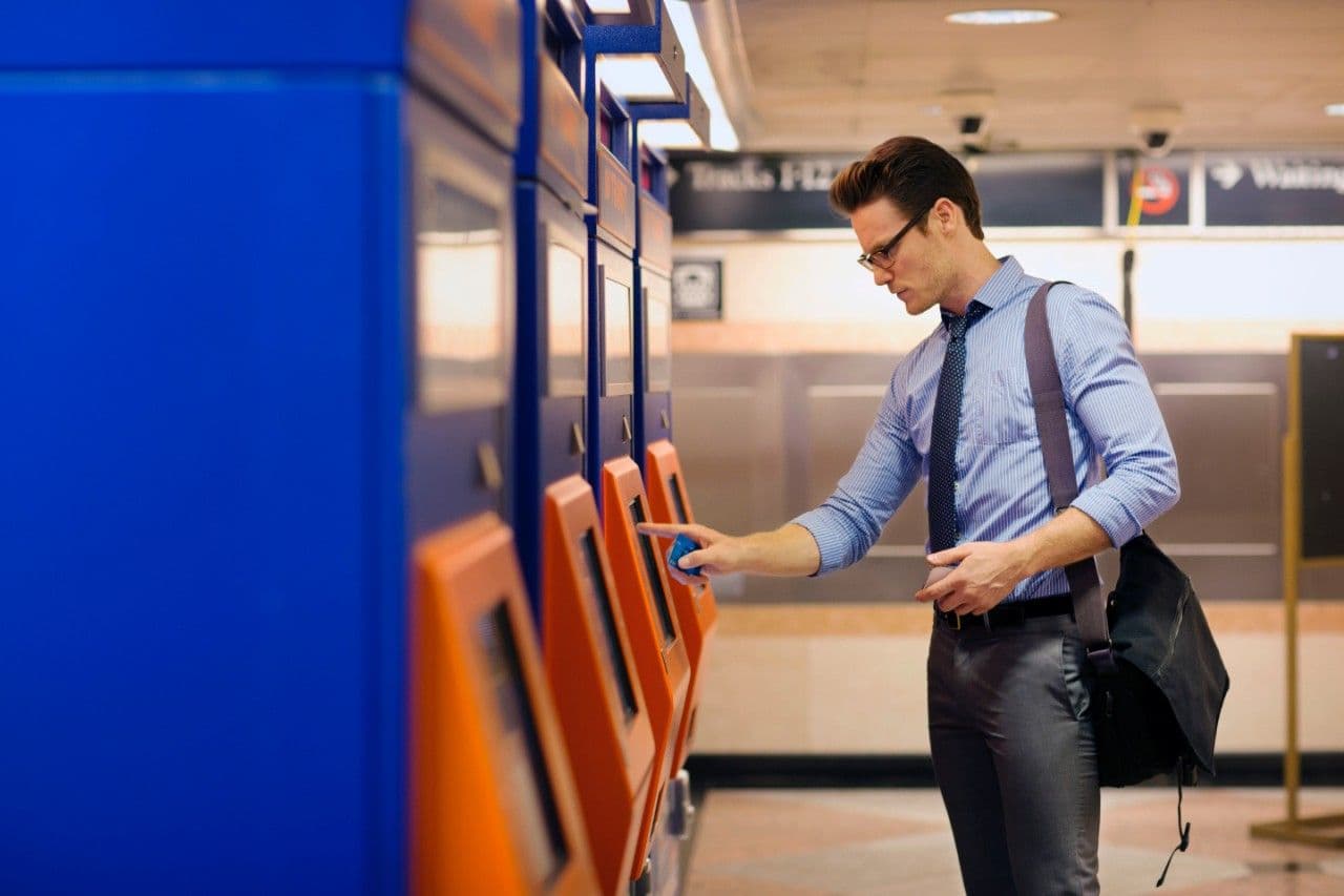 Man buying ticket for train