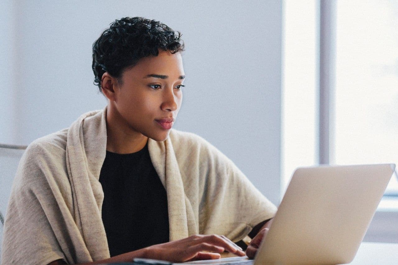 Woman browsing on laptop